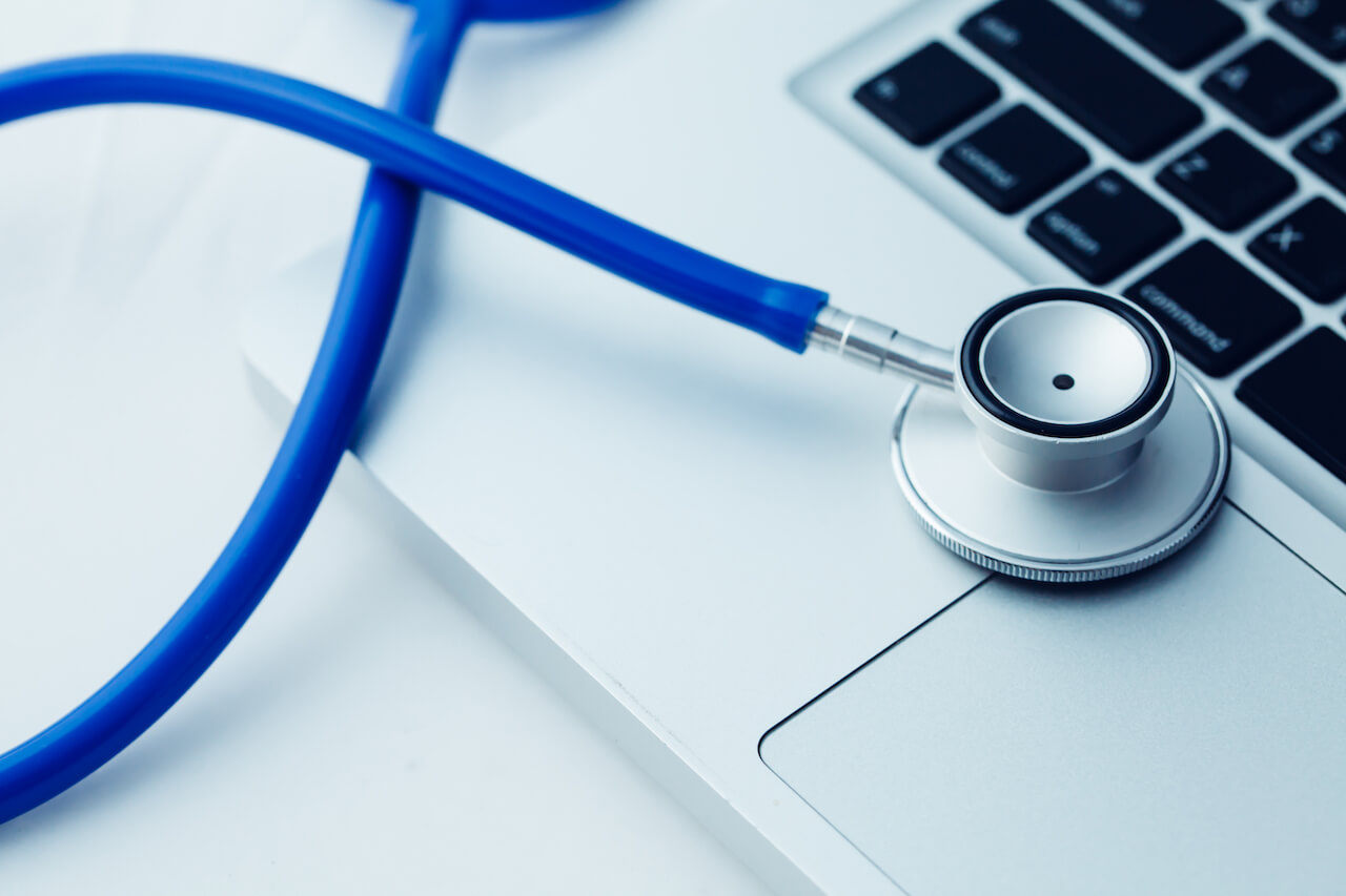 Stethoscope on laptop - website health check ads interactive ad monetization platform